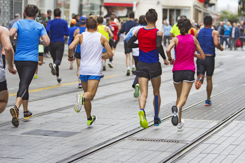 Runners in a marathon running away from perspective.